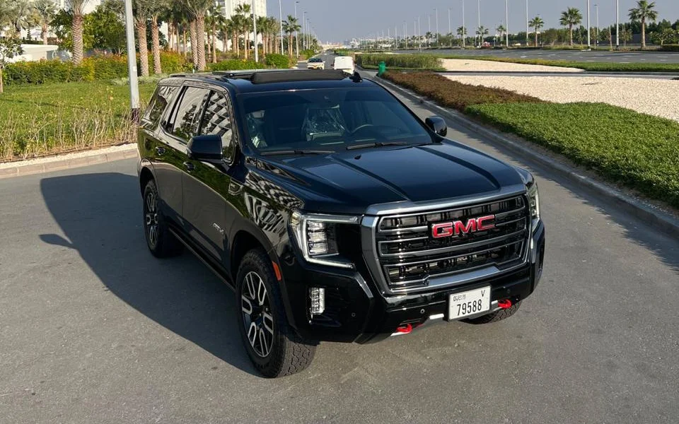 GMC Yukon AT4 2024 in black, front three-quarter view